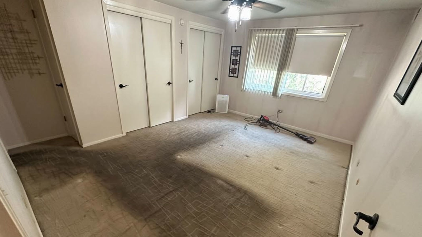 The same bedroom emptied and swept after the cleanout