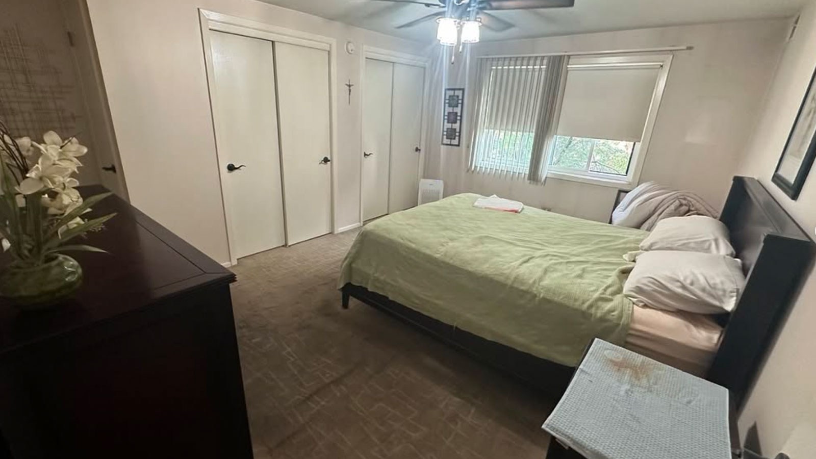 A bedroom filled with furniture before a Junk Jaws cleanout